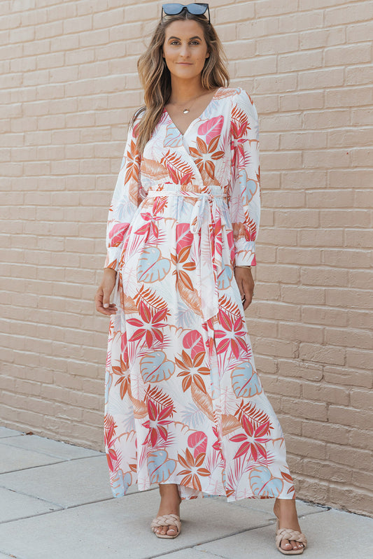 Vestido largo con abertura y cuello en V cruzado de manga larga con estampado de plantas tropicales