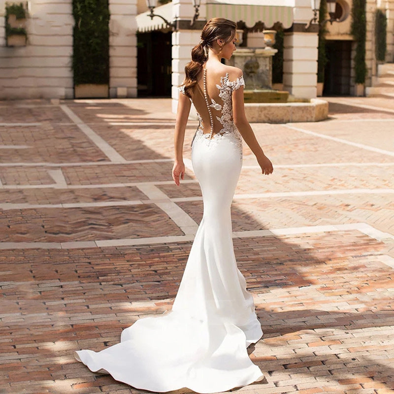 Vestido de cola de pez hueco para mujer con cuello profundo de boda