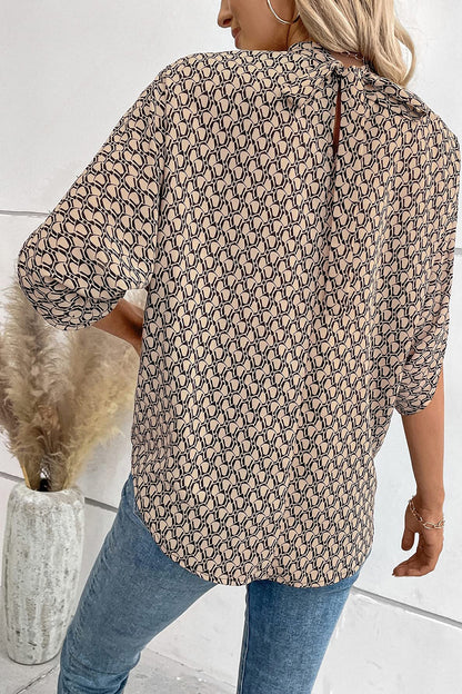 Blouse à manches mi-longues fendue au dos et nouée