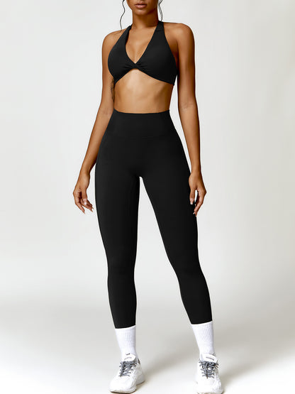 Ensemble actif soutien-gorge dos nu torsadé et leggings taille haute