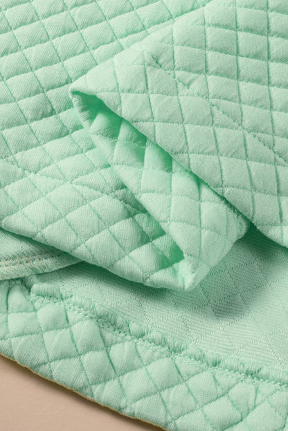 Veste matelassée verte avec poche à rabat et patchwork de blocs de couleur